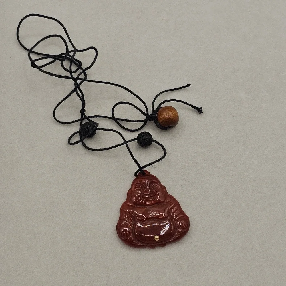 Carved Red Stone Laughing Buddha Pendant Black Cord Necklace Gold Tone Accent